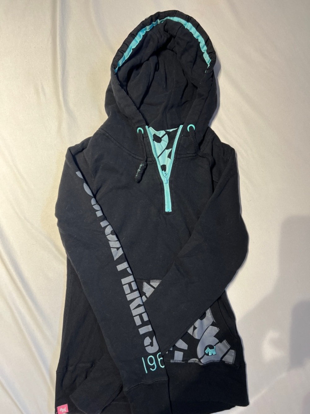 Joshua Perrets Black Hoodie with Teal Trim and Graphic Accents